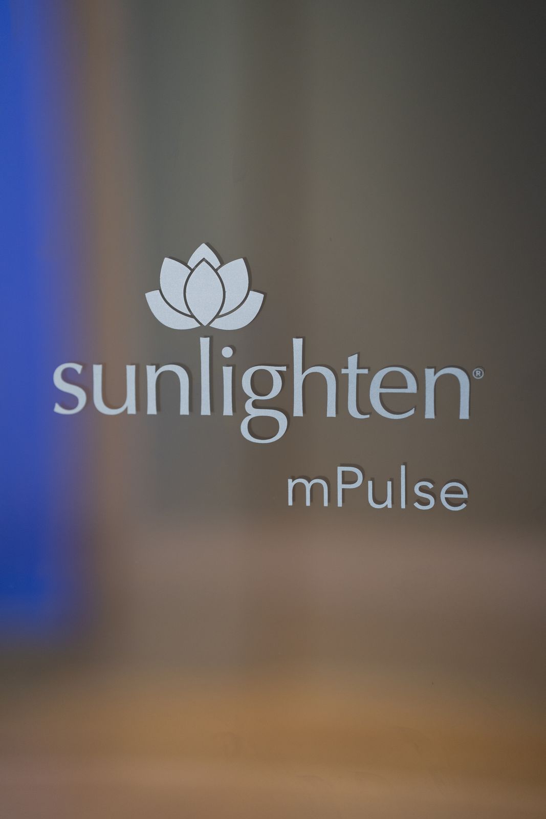 Sunlighten mPulse logo etched on the sauna glass